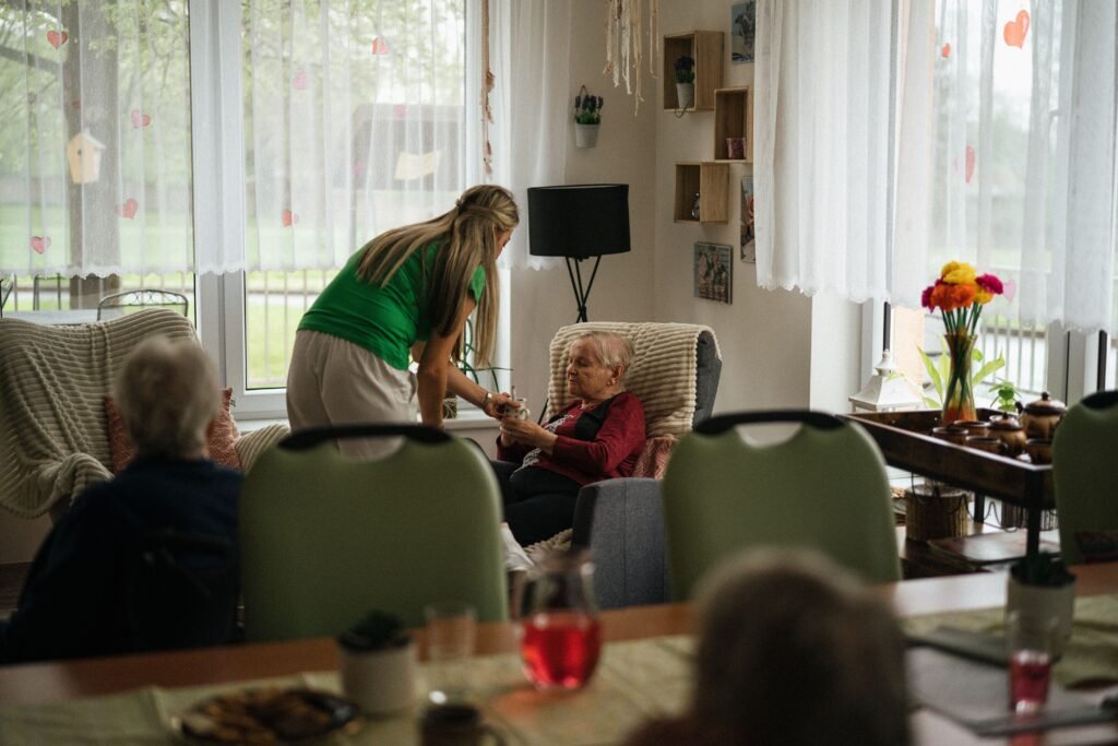 Senior living staff member with a resident and family member as part of senior living and assisted living marketing services