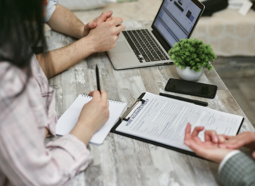 Insurance agent reviewing policy options with a client as part of insurance agency marketing services