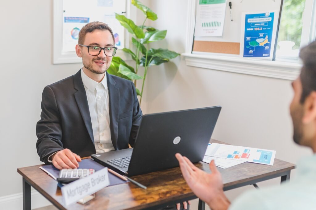 Mortgage broker reviewing loan options with a client as part of mortgage broker marketing services