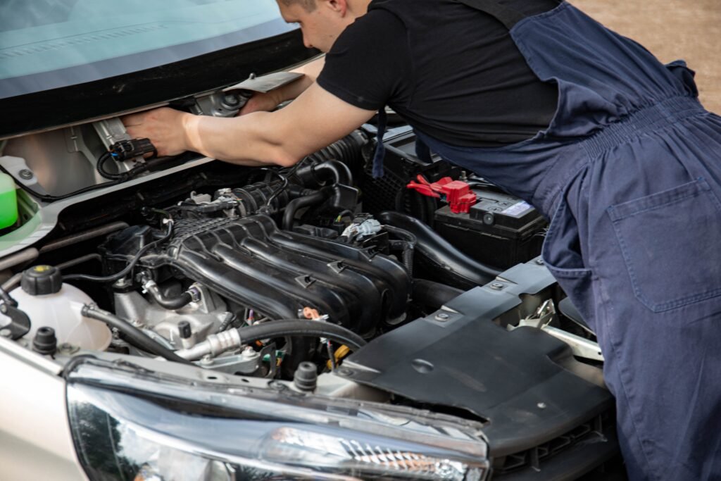Auto repair technician reviewing service work with a customer as part of auto repair and dealership marketing services
